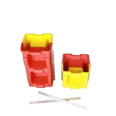 Китай Wholesale supply high quality plastic injection red yellow interlocking concrete hollow block mold продается