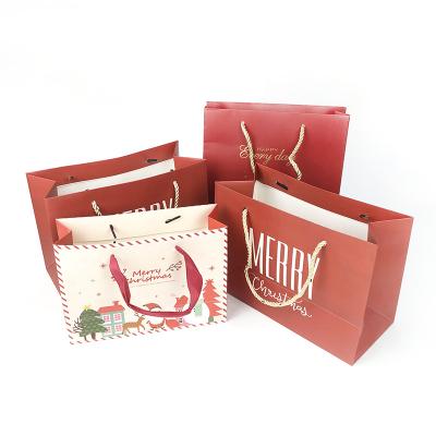 China Christmas Series Gold Stamping Handled Custom Printing Paper Bags For Gift for sale