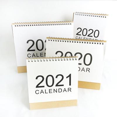 China Custom High Quality Printing Yarn O Calendar Table Cardboard Binding Paper High Quality Desk Calendar for sale