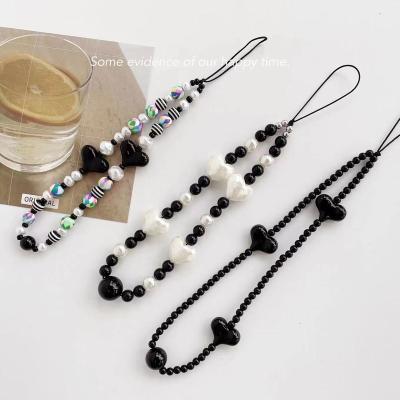 China New Korean Version Black Cartoon Love Acrylic Beaded Lanyard Mobile Phone Chain for sale