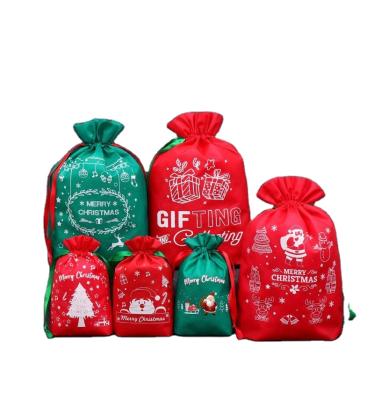 China Newcomer To Santa Merry Christmas Bag Recyclable Gift Candy PP Custom Non Woven Ribbon Pouch Silk Bag for sale