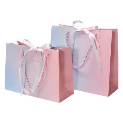 China 2019 recyclable new white paper gift bag for candy or snacks or cosmetics or clothes for sale