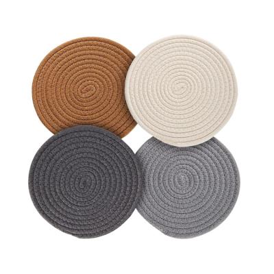 China Sustainable Set of 4 Pieces Round Woven Table Mat Pure Cotton Place Mat Fabric Heat Resistant Coaster for sale