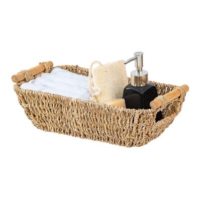 China Sustainable Cheap Handwoven Wicker Basket Seaweed Storage Basket With Wooden Handle for sale