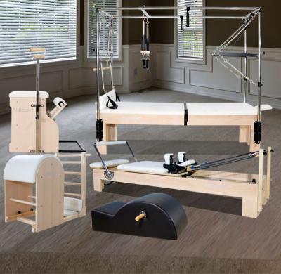 China Fitness Center Pilates Reformer Cadillac Bed Chair Ladder Barrel and Spine Corrector for Studio Wood Full Set for sale