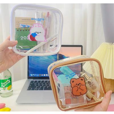 China Fashion Durable Custom Plastic Transparent Travel Bag Clear PVC Women Makeup Cosmetic Bag Cute Organizer for sale