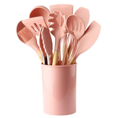 China Sustainable Kitchenware Set 12 Piece Kitchen Gadgets Tools Hold Kitchenware Spatula Silicone Cookware Set With Wooden Handles for sale