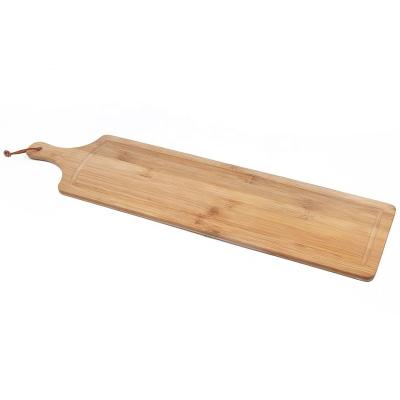 China Long Sustainable Bamboo Vegetable Bread Cutting Board With Handle And Juice Groove For Camping for sale