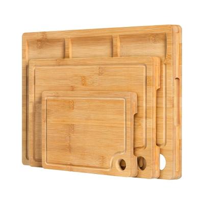 China Sustainable Heavy Duty Kitchen Bamboo Cutting Board Set of 3 with 3 Integrated Juice Compartments and Grooves for sale