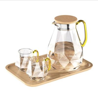 China Viable Creative Simple Lid Tea Kettle Milk Pot Glass Tea Gift Set Home Office Use Heat Resistant Glass Jug Thicken Transparent Custom for sale