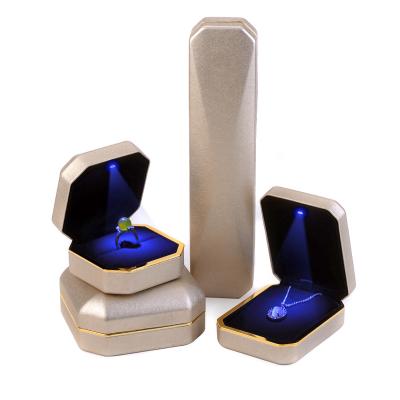 China Custom Leather Led Jewelery Storage STRATEGY PU Ring Box Necklace Box With Led Velvet Light Wholesale Led Jewelry Box With Logo for sale