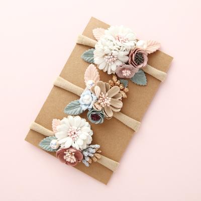 China Cute Baby Hair Accessories Set Of A Popular Material Nylon Flower Pearl Rope Elastic Hair Band Combination Friendly for sale