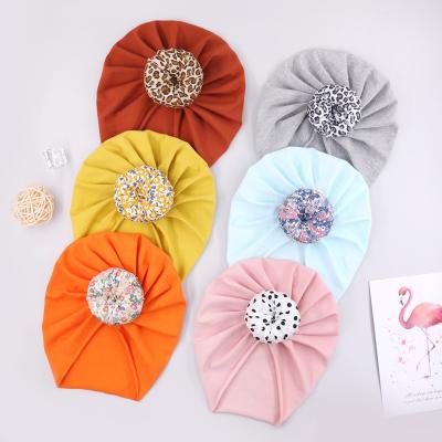 China Material Friendly 0-6 Months Fashion New Cotton Color Donut Printed Knot Baby Turban Wholesale Baby Hat Turban for sale