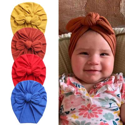 China Fashion Friendly Material Rabbit Ears Knotted Indian Newborn Elastic Cotton Turban Toddler Baby Soft Hat for sale