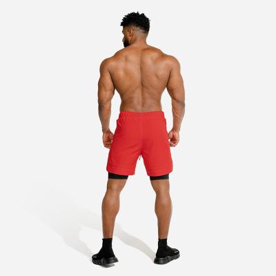 China Anti-Wrinkle Wholesale Gym Shorts Men's Summer Shorts New Double - Layer Cell Phone Pants Gym Exercise Jogging Pants Hyperdry for sale