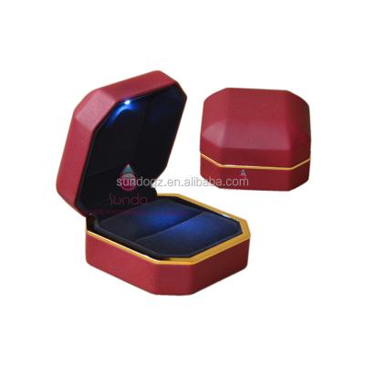 China Plastic Velvet Luxury Metal Jewelry Packaging Customs Lead Ring Box With Light for sale