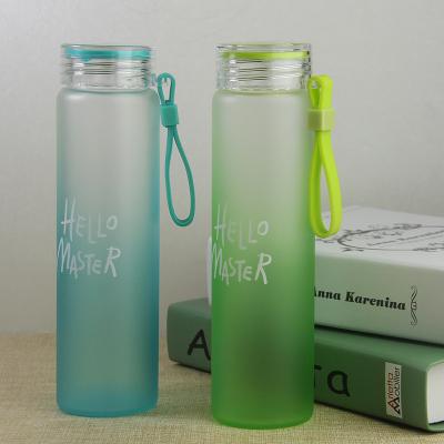 China 16 oz stocked glass water bottle with classic cap and silicone sleeve molten gold for sale