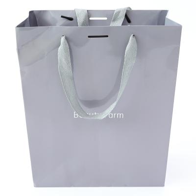 China Cheap biodegradable low price moq buy biodegradable watch gift bag china logo custom paper bag for sale