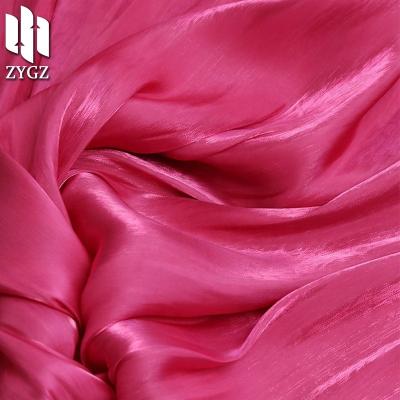 China Pure Bright Sea Island Polyester Satin Rainbow Dress Fabric Silk Organza Factory Wholesale for sale