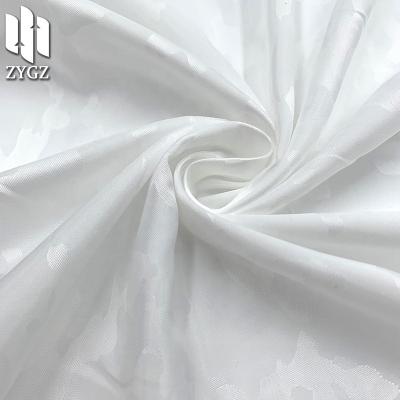 China Wind proof fashion brand double sided jacquard fabric satin jacquard clothing fabric luggage lining wholesale for sale