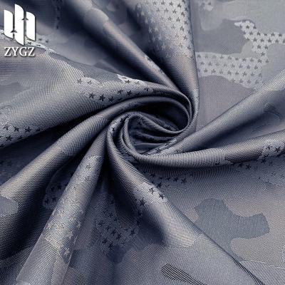 China Wind Proof Pentagon Camouflage Yarn-Dyed Jacquard Fabric Taron Memory Cloth Garment Bag Cloth Lining Fabric for sale