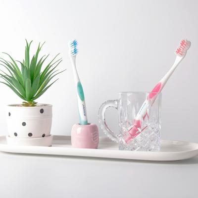 China Good Quality Oral Adult Toothbrush Double Care Effect Rounded Bristles OEM Wholesale Free Sample Customized for sale