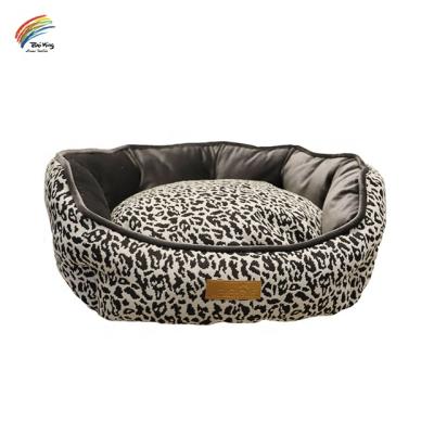 China Hot Selling Leopard Print Jacquard Print Round Nest Fashion Single Heating Pet Bed for Dog and Cats Washable and Waterproof Bottom Luxury Dog Bed for sale