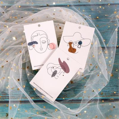 China Custom Paper Black Or Recyled Factory Price Label Paper Tag White Card Cotton Beauty Earring Folded Jewelry Card for sale