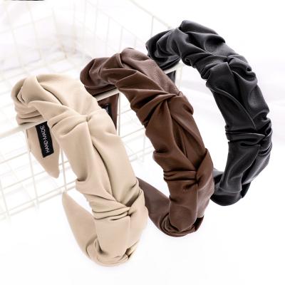 China Custom Pleated Flower Bud Press Pu Leather Logo Headband New Designs Fashion Durable 2021 Retro Fashion Newcomers for sale