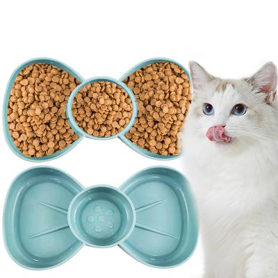 China Cartoon Bow Shape Plastic Dog Bowl 2 Bowl High Quality Viable Wholesale Pet Double In 1 Pet Food Bowl for sale