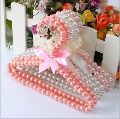 China Sustainable Fashionable And Luxurious Pearl Pet Clothing Accessories Dog Hanger Colorful for sale