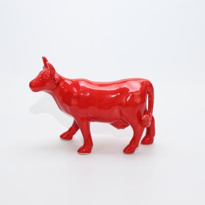 China Home Decoratiove CERAMIC Wonderful Red Color Glazing Figurine Decorative Cow for sale