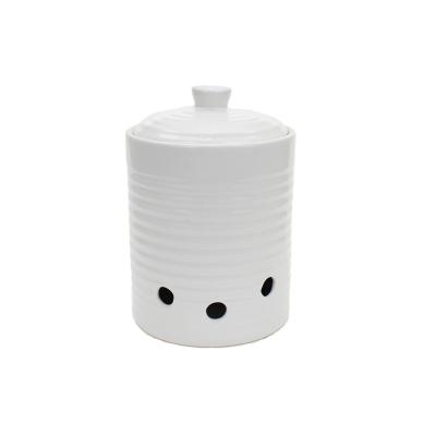 China Sustainable White Ceramic Garlic Keeper Pot Vented Ceramic Storage Container With Lid for sale