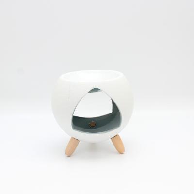 China Round Shape Chinese Censer Incense Ceramic Oil Burner with 3 Wooden Legs for sale