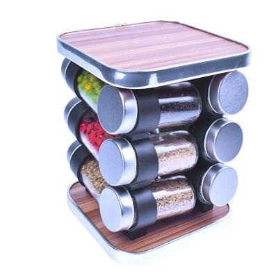 China Sustainable 12 Pcs Glass Pepper Spice Salt Bottle Jars Sets With Wooden Rotate Spice Rack For Home Kitchen for sale