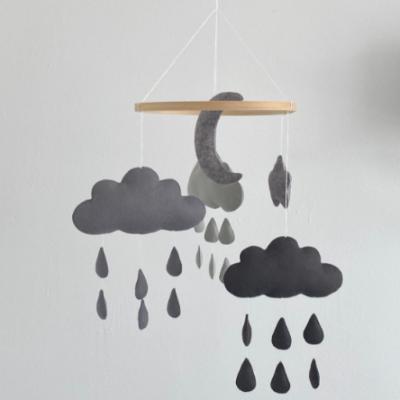 China Unique Nordic Monochrome Hanging Soft Toy Decor Moon and Raindrops Baby Black White Boy Felt Nursery Cloud Crib Mobiles for sale