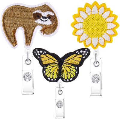 China Wholesale Badge Reel Clip Glitter Sloth Flower Butterfly Felt Retractable Badge Reel Clip Care Badge Holders for sale