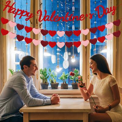 China Polyester Felt Low MOQ Simple Design Wholesale Laser Cut Valentine Day Happy Banners Felt Love Heart Garlands For Valentine Home Decoration for sale