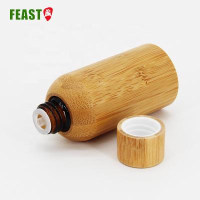 China Essential Oil Cosmetic Bottle 50ml Bamboo Cosmetic Bottles Empty Airless Lotion Bottle With Screw Lid for sale