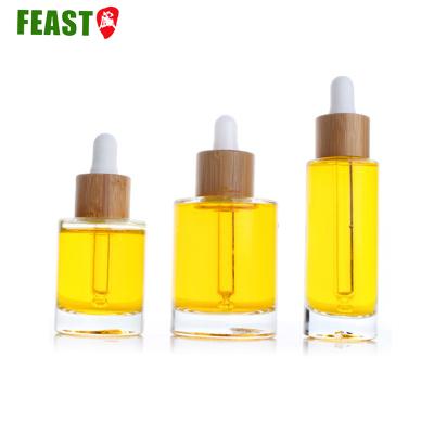 China 15ml bamboo glass essential oil cosmetic packaging essential oil bottle with bamboo lid dropper glass cosmetic for sale