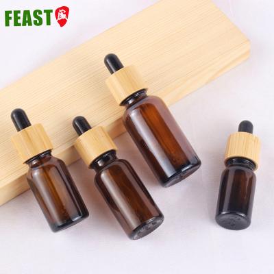 China 30ml 50ml 100ml Amber Glass Dropper Bamboo Pumps Essential Oil Cosmetic Custom Bottle for sale