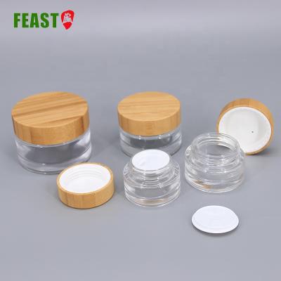 China Top grade cosmetic package face cream jar 50ml glass jar cosmetic packaging cover glass bamboo cosmetic jar for sale