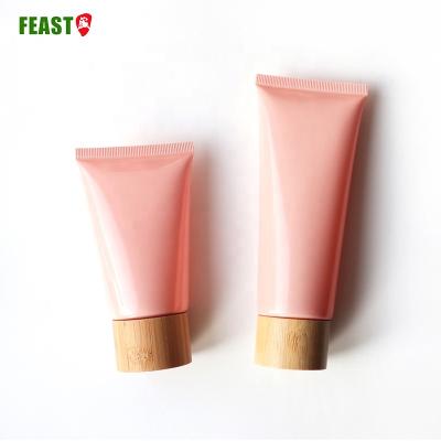 China Bamboo Plastic Cosmetic Flat Pink Face Wash Tube Lid Personal Care 60g Soft Screw Tube for sale