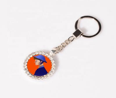 China Eco - Friendly Sublimation White Round Metal Key Chain With Diamond for sale