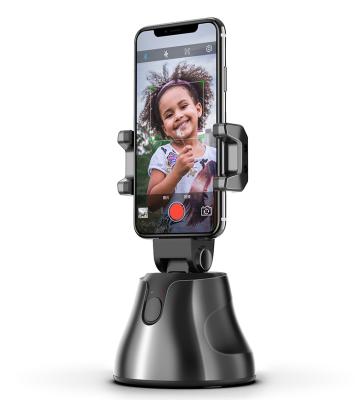 China 360 Degree Rotation Auto Aluminum Face Object Smart Selfie Tracking Stick Shooting Camera Phone Holder for sale