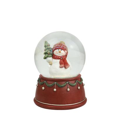 China Custom Christmas Snow Globe ABS Christmas Gifts Plastic Base Tree Decoration Europe Christmas Snow Globe for sale