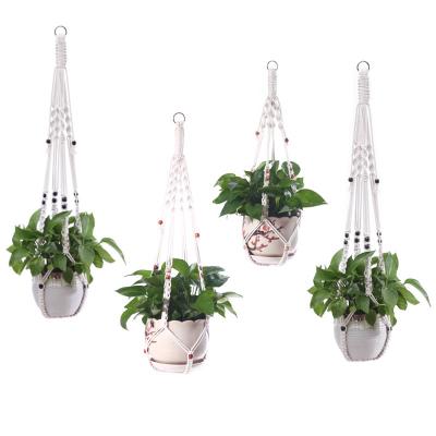 China Bohemian Set of 4 Hanging Baskets Flowerpot Plant Hangers Macrame Rope Holders Balcony Yard Garden Wall Decor Handmade Plant for sale