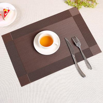 China Durable PVC Table Mats For Restaurant Decorations Heat Resistant Vinyl Place Mats Kitchen Crossweave Woven Non Slip Place Mats for sale