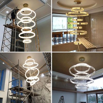 China Modern HUIHANG Customized Large Circular Crystal Stainless Steel Structure Led Chandelier Duplex Villa High Rise for sale