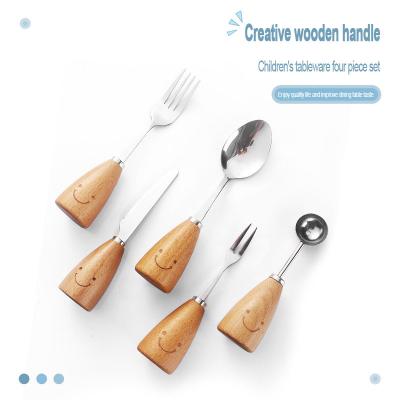 China Viable Wholesale Creative Stainless Steel Tableware Set Cute Bamboo Kids Cutlery Set Wooden Handle Spoon Knives Fork Flatware for sale